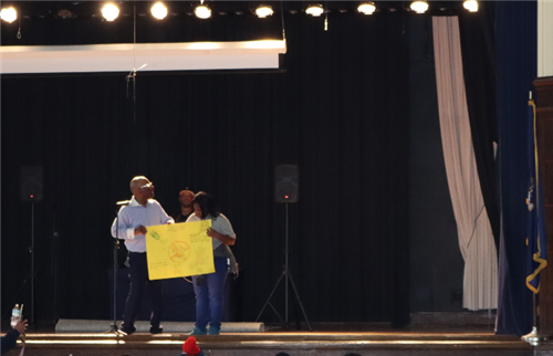 2 people holding a poster